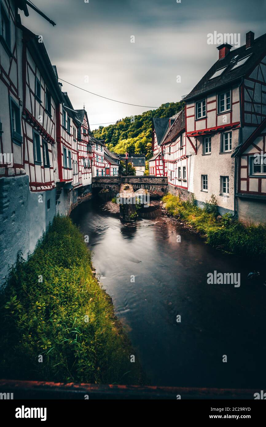 Monreal in the Eifel in Germany. A small half-timbered village directly on a river with a beautiful stone bridge Stock Photo