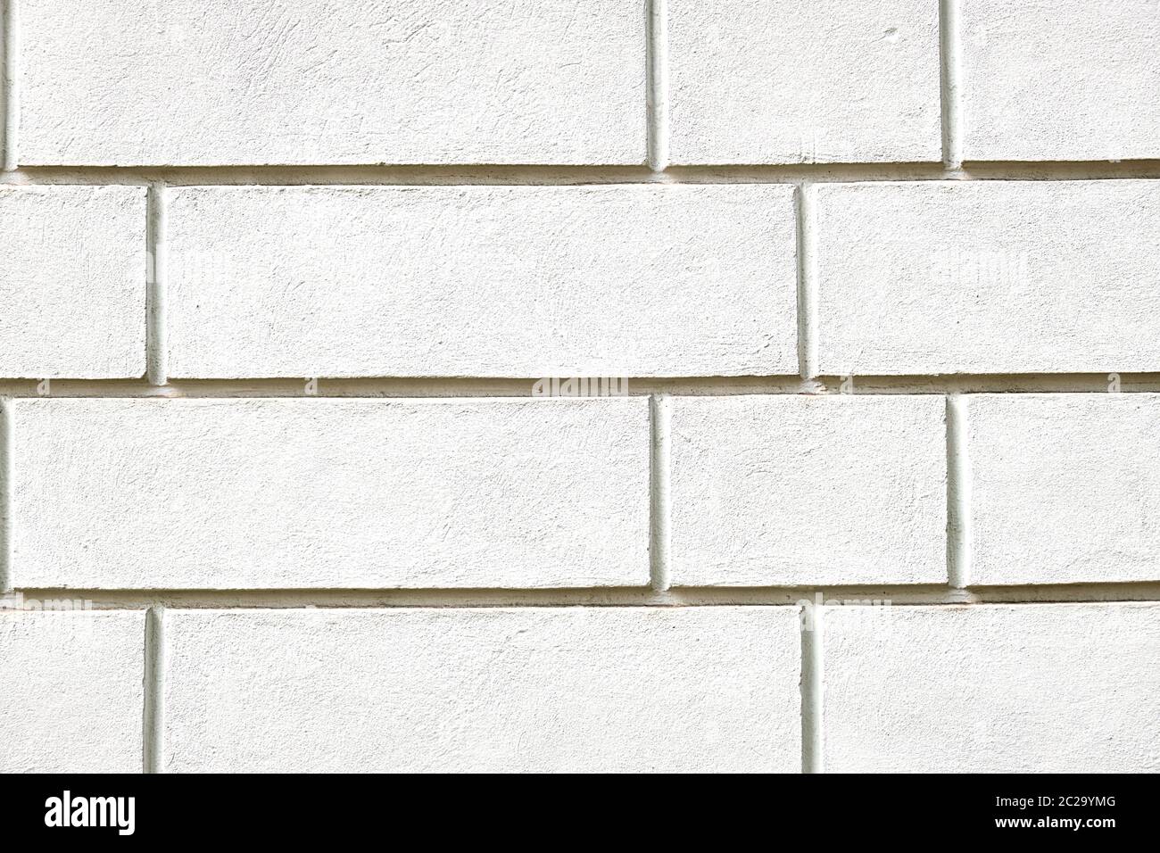 Background from a wall with white stone slabs Stock Photo