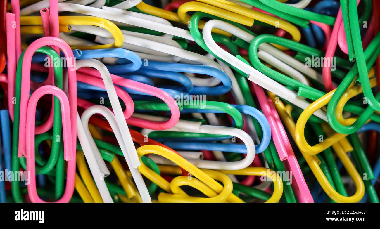 Bunch of color paperclips on a box Stock Photo Alamy