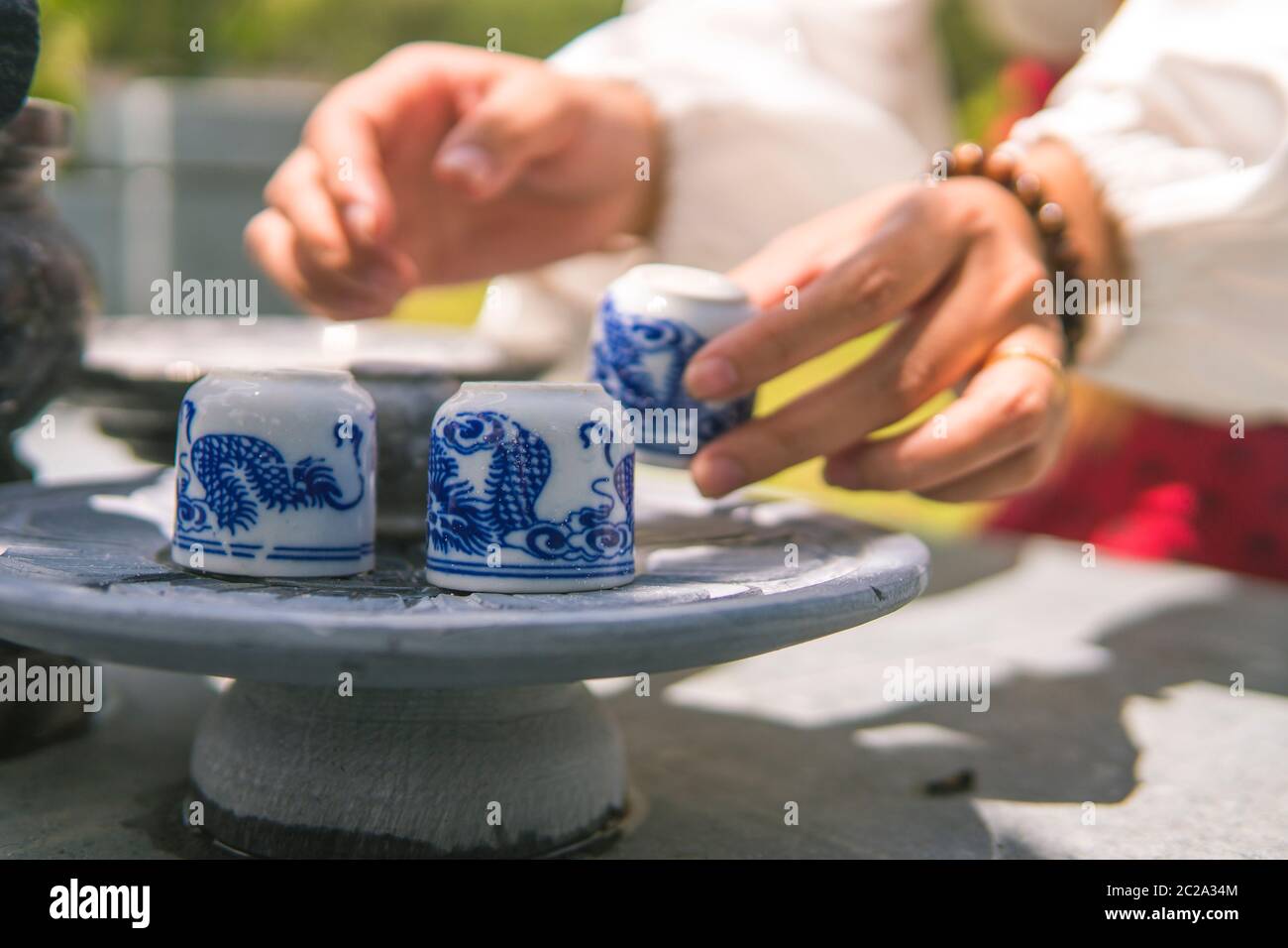 Praying and sacrificial offering food and joss paper to ancestors in