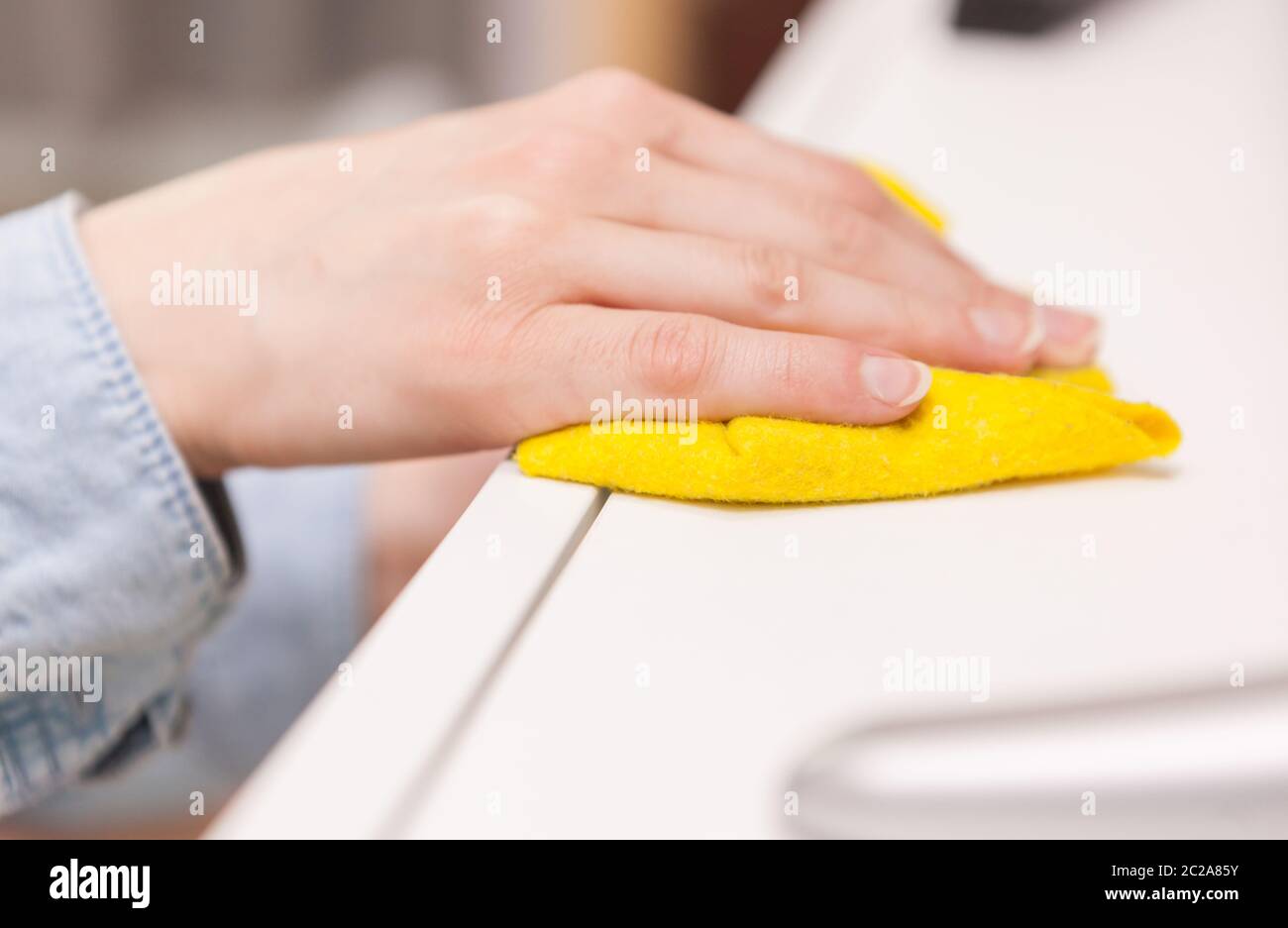 Hand Of Housewife Dusting The Surface Of Tv Stand Stock Photo Alamy