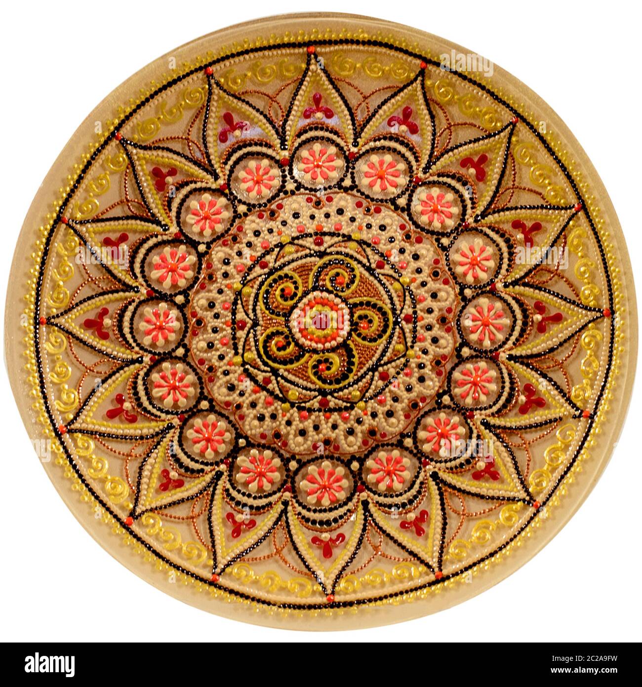 Decorative ceramic dish painted with a circular pattern, isolated on a