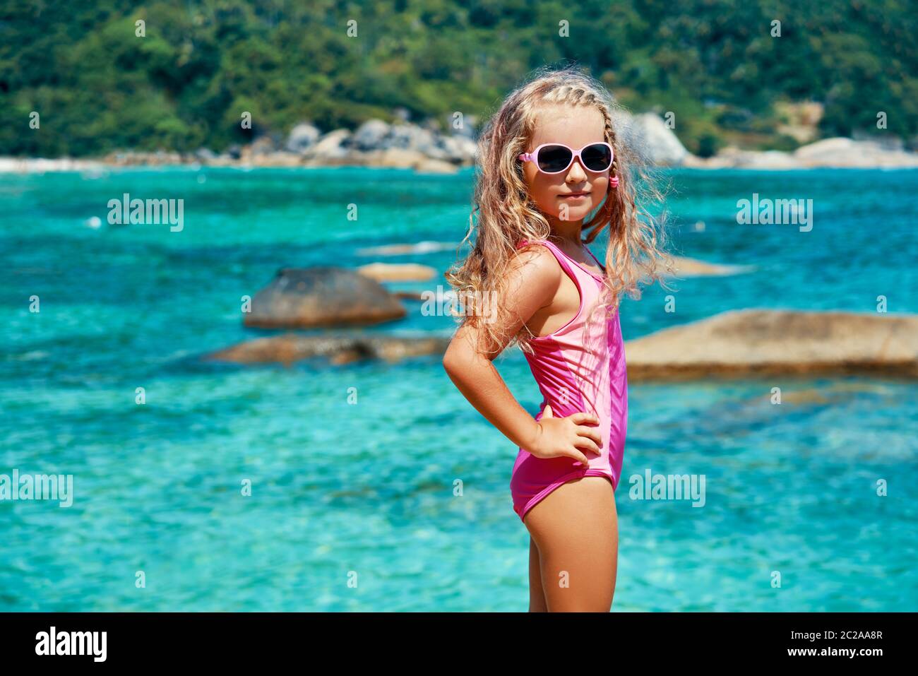 Beautiful little girl posing beach hi-res stock photography and ...