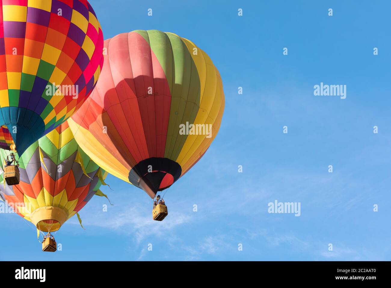 Multi colored hot air balloons on blue sky Stock Photo - Alamy