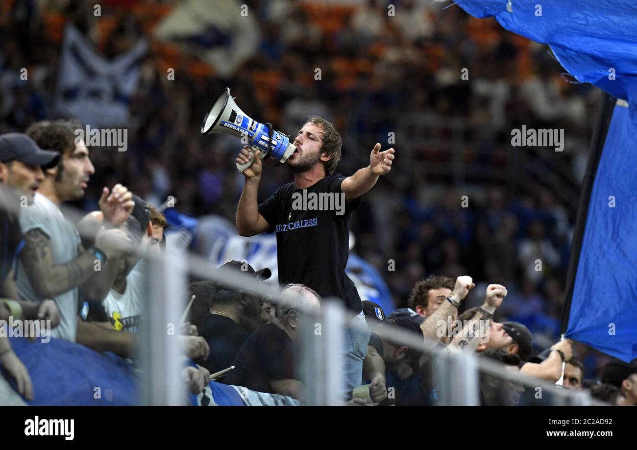 Atalanta's soccer fans cheering during the UEFA Champions League match, Atalanta vs Shakhtar Donetsk, in Milan. Stock Photo