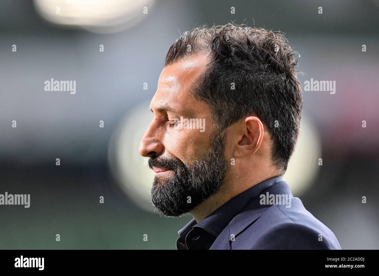 Bremen, Germany. 16th June, 2020. Football: Bundesliga, Werder Bremen - FC Bayern Munich, 32nd matchday at the Wohninvest Weser Stadium. Bayern sports director Hasan Salihamidzic closes his eyes before the soccer match. Credit: Martin Meissner/AP-Pool/dpa - IMPORTANT NOTE: In accordance with the regulations of the DFL Deutsche Fußball Liga and the DFB Deutscher Fußball-Bund, it is prohibited to exploit or have exploited in the stadium and/or from the game taken photographs in the form of sequence images and/or video-like photo series./dpa/Alamy Live News Stock Photo