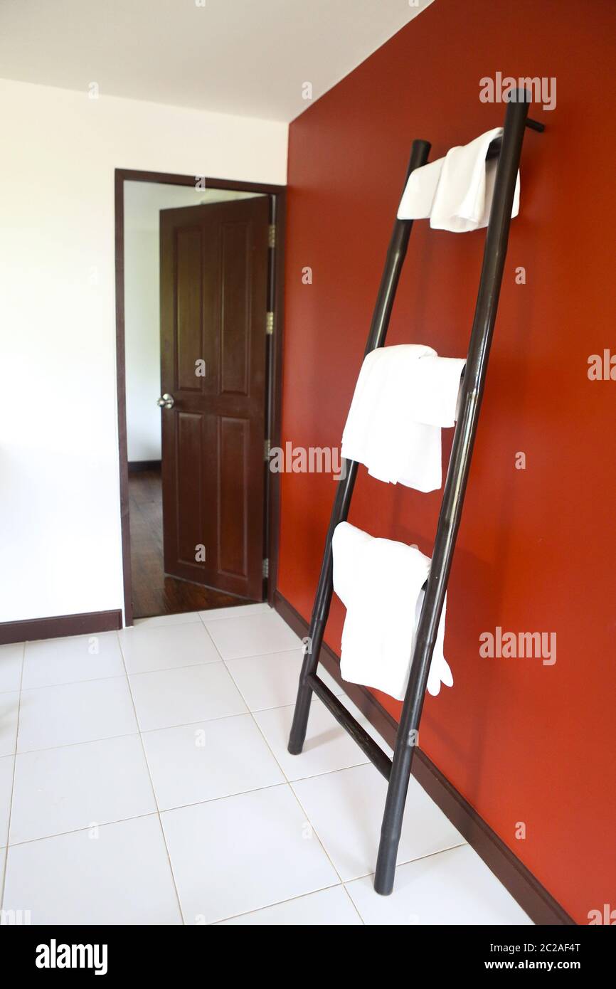White towels hanging on rustic wooden ladder Stock Photo Alamy