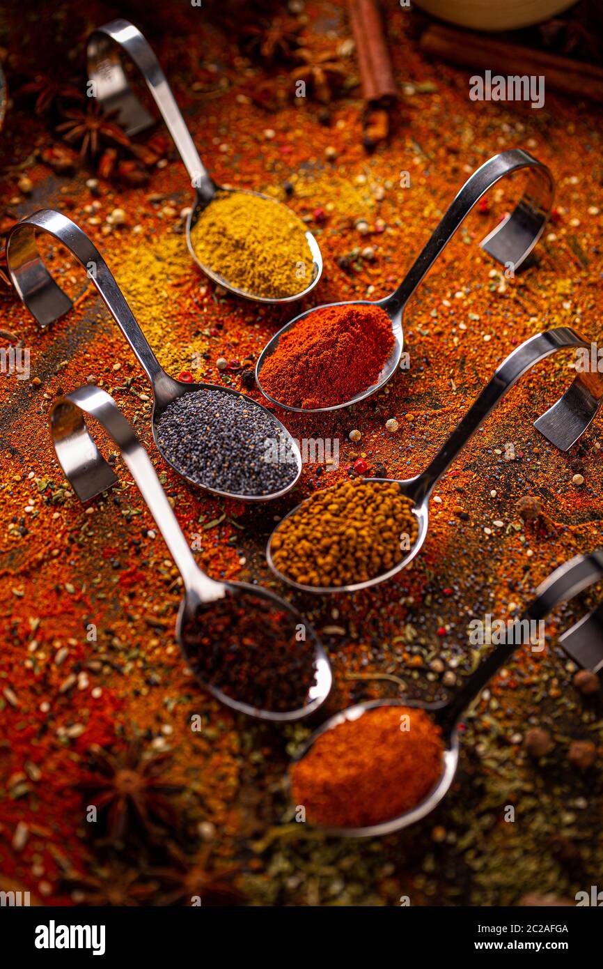Various spices in spoons, spices and herbs composition Stock Photo