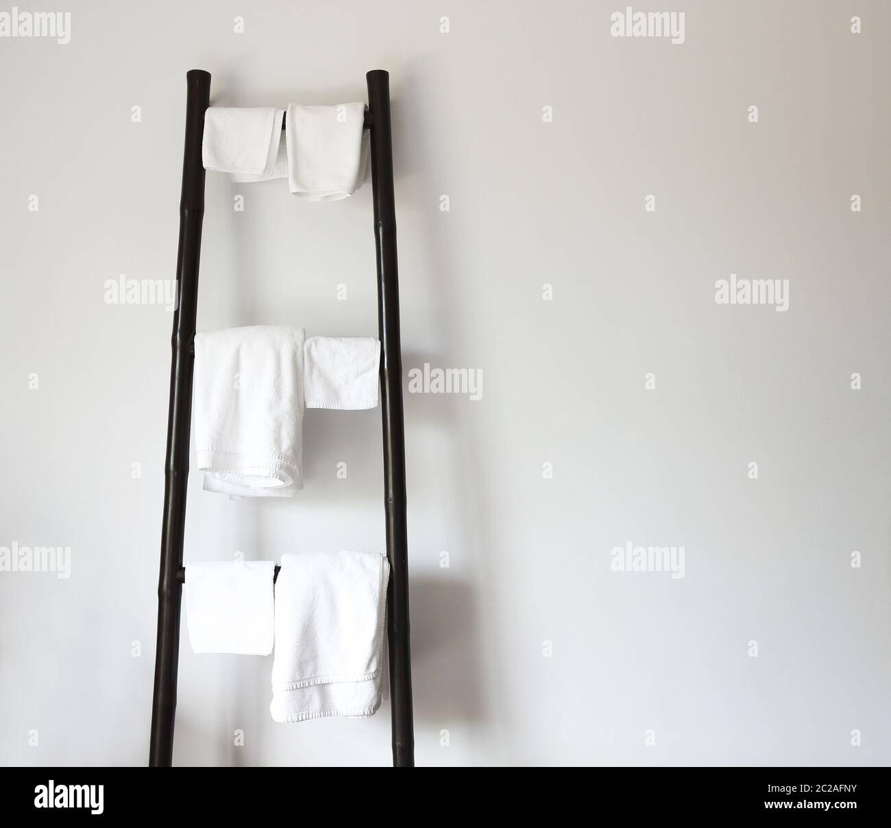 White towels hanging on rustic wooden ladder Stock Photo Alamy
