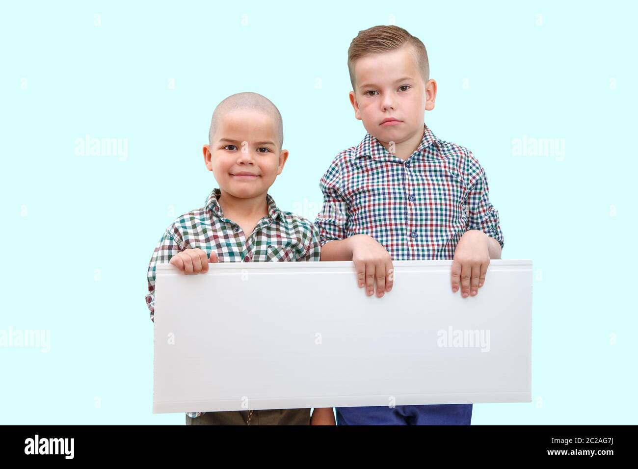 Two boys holding hands hi-res stock photography and images - Alamy