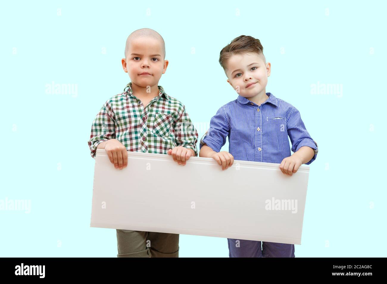 Two boys holding hands hi-res stock photography and images - Alamy