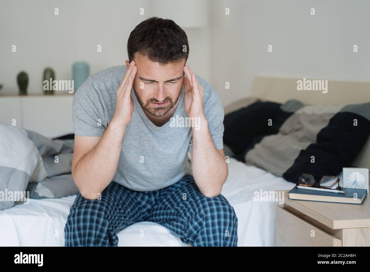 Man with sleeping problem wake up feeling tiredness Stock Photo