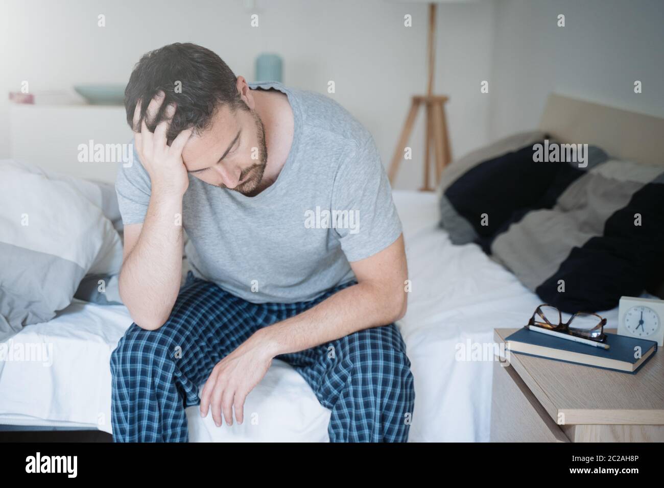 Man with sleeping problem wake up feeling tiredness Stock Photo