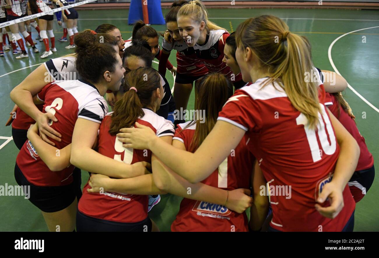 Youth female volleyball teammates support each others, during a youth female volleyball final, in Milan. Stock Photo