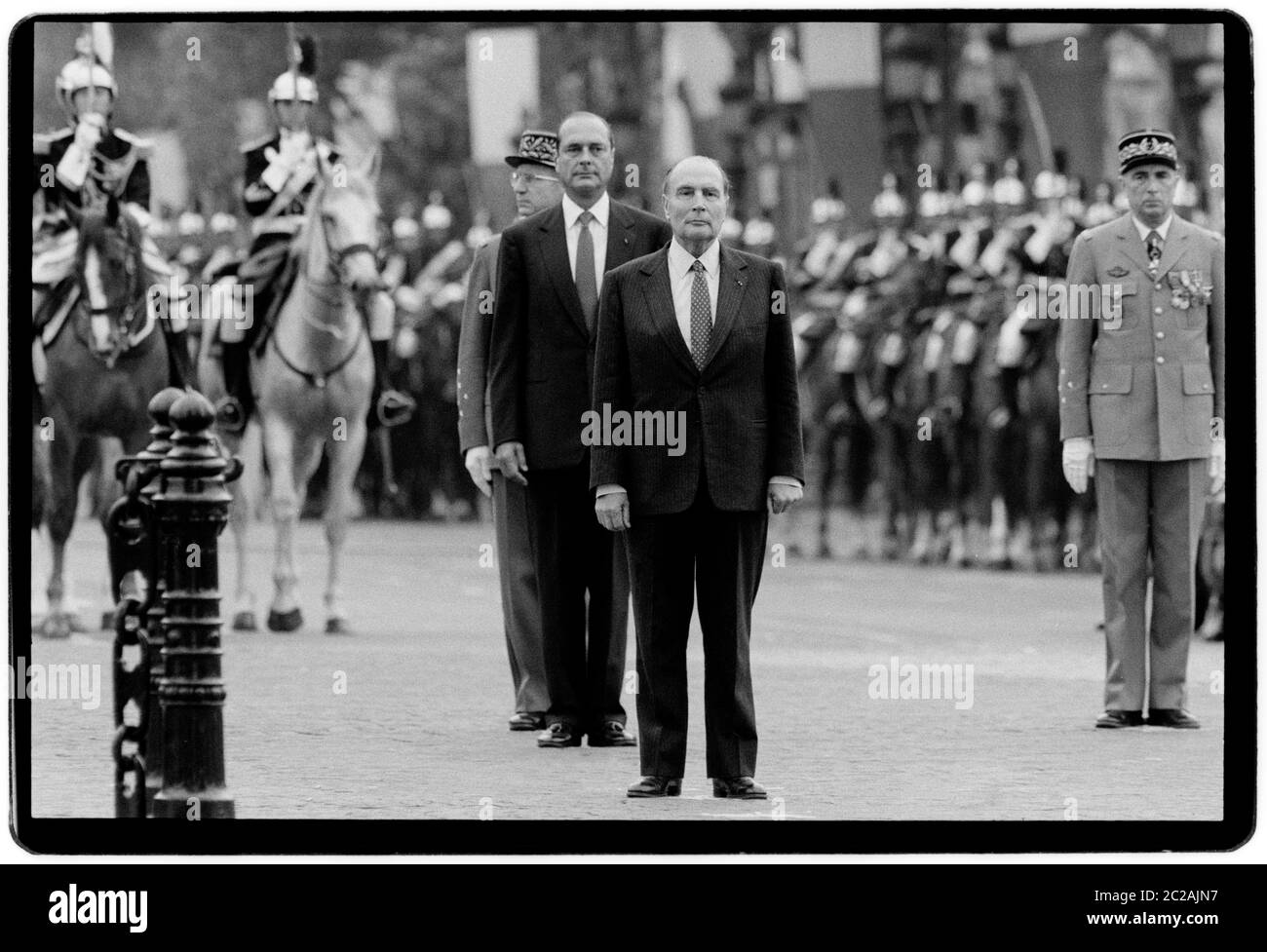 President of France Francois Mitterrand and Jaques Chirac Mayor of Paris at the 1988 Bastille day celebrations during the Presidential and national Assembly elections in 1988.  Bastille Day is the common name given in English-speaking countries to the national day of France, which is celebrated on 14 July each year. In French, it is formally called Fête nationale 'National Celebration' and commonly and legally le 14 juillet; 'the 14th of July').  The French National Day is the anniversary of Storming of the Bastille on 14 July 1789, a turning point of the French Revolution, as well as the Fête Stock Photo