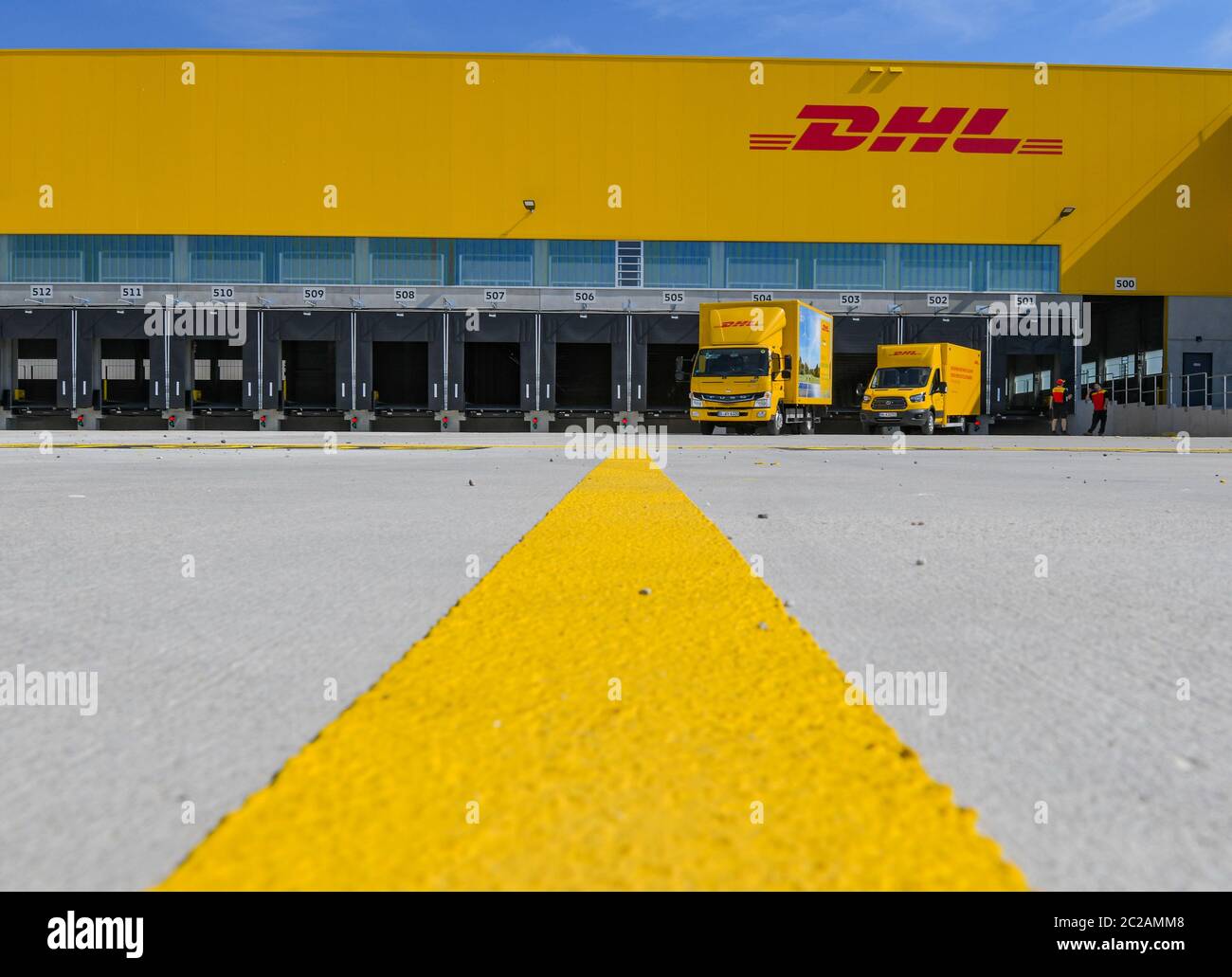 Ludwigsfelde, Germany. 17th June, 2020. View of the new construction of a parcel centre of the Deutsche Post. On the same day the first construction phase was completed with the completion of the shell for the new parcel centre. In future, up to 50,000 parcels per hour will be sorted in the parcel centre. According to the company, the third DHL 'mega parcel centre' in Germany and one of the most modern in Europe is being built on around 165,000 square metres. More than 600 new jobs will be created in the region. Credit: Patrick Pleul/dpa-Zentralbild/dpa/Alamy Live News Stock Photo