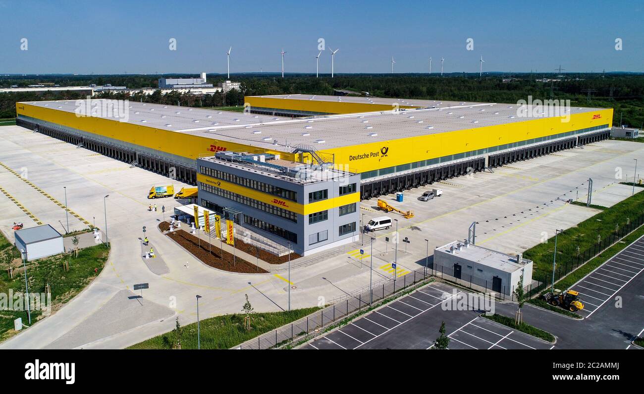 Ludwigsfelde, Germany. 17th June, 2020. View of the new construction of a parcel centre of the Deutsche Post. On the same day the first construction phase was completed with the completion of the shell for the new parcel centre. In future, up to 50,000 parcels per hour will be sorted in the parcel centre. According to the company, the third DHL 'mega parcel centre' in Germany and one of the most modern in Europe is being built on around 165,000 square metres. More than 600 new jobs will be created in the region. Credit: Patrick Pleul/dpa-Zentralbild/dpa/Alamy Live News Stock Photo