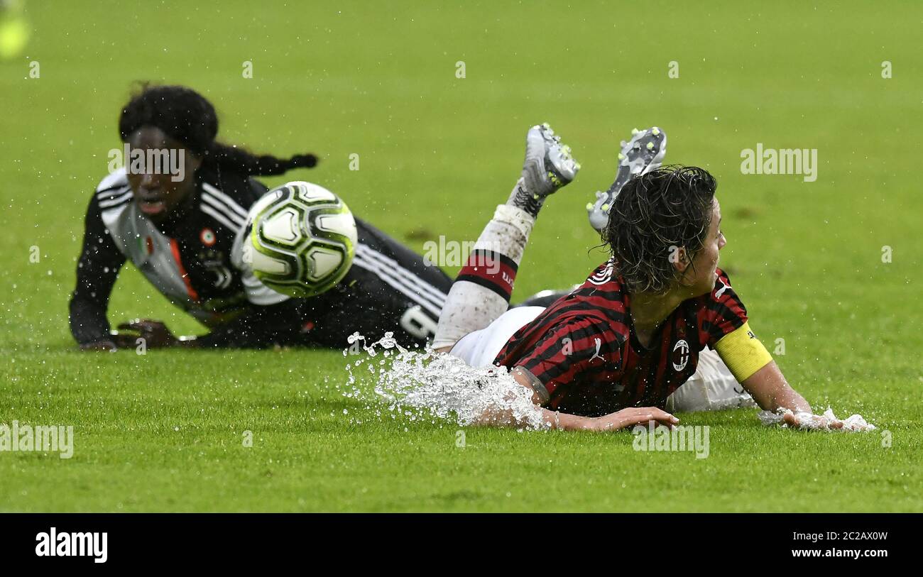 female soccer players action, on a wet green soccer field, during the italian soccer match AC Milan vs Juventus FC, in Monza. Stock Photo