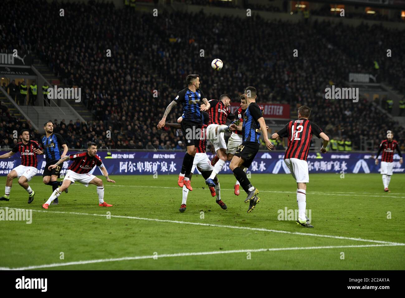 soccer players action during the italian Serie A soccer match AC Milan vs Inter Milan, at the san siro stadium, in Milan. Stock Photo