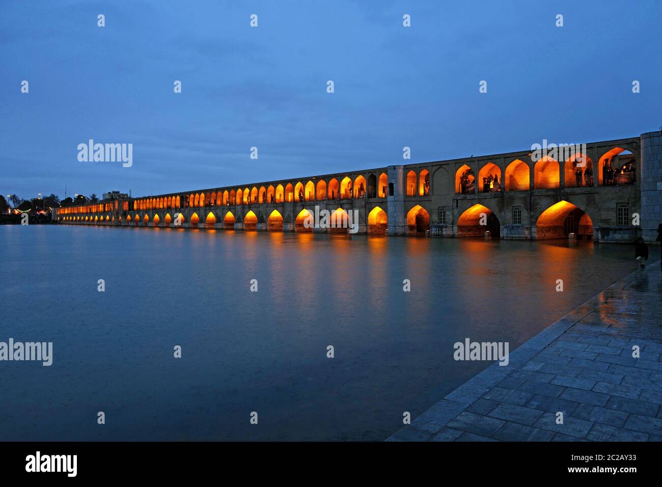 Golden night lights on Khaju bridge, in Isfahan, Iran. Stock Photo