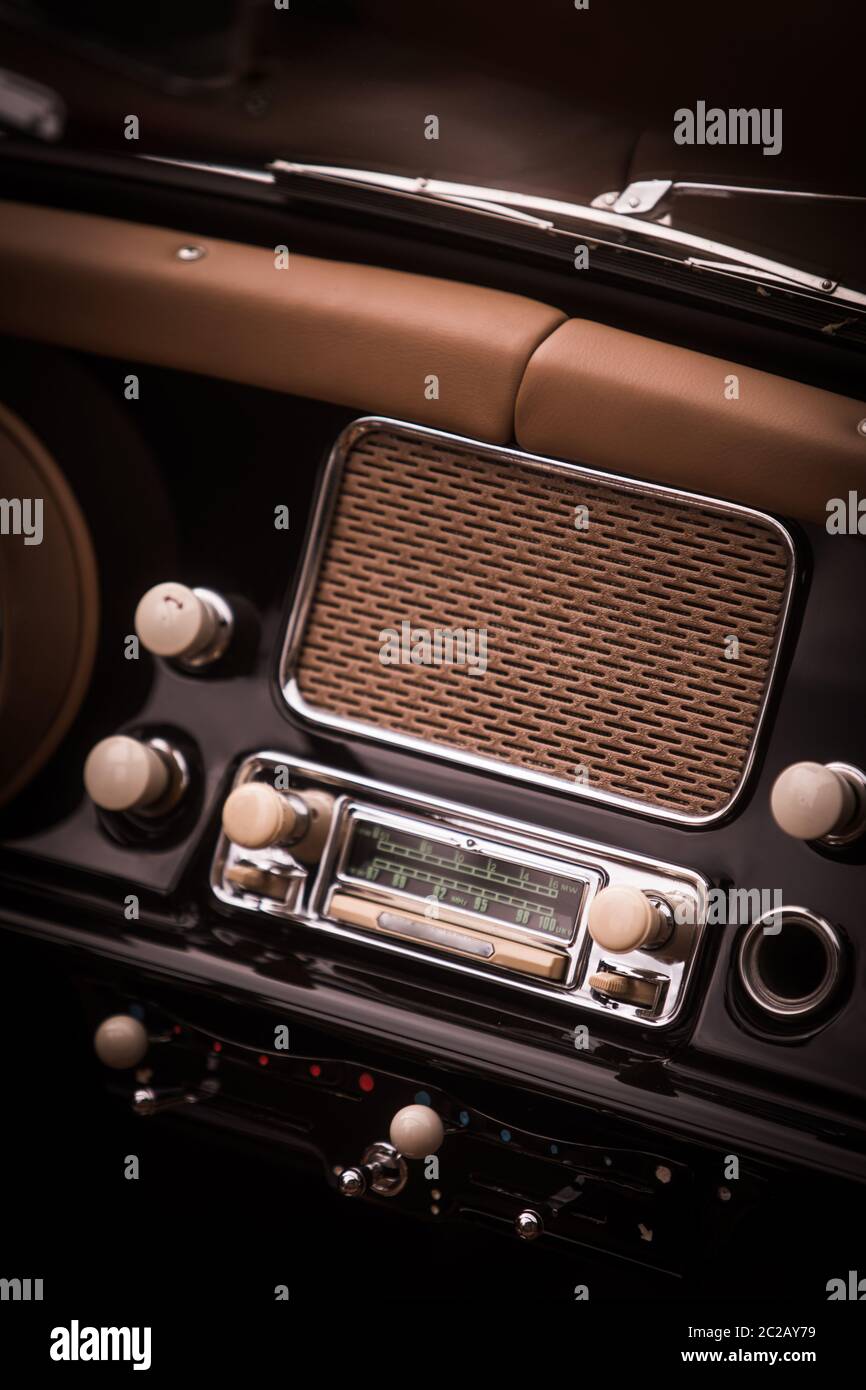 Close up shot of a classic vintage car stereo on the dashboard Stock