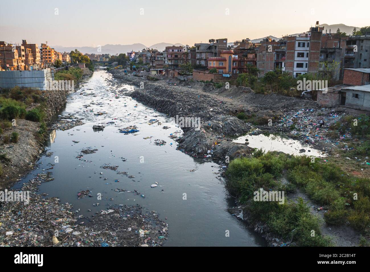 Contaminated river runs through city. waste is discarded river bank. lack of waste collection services. Kathmandu, Nepal, Asia Stock Photo