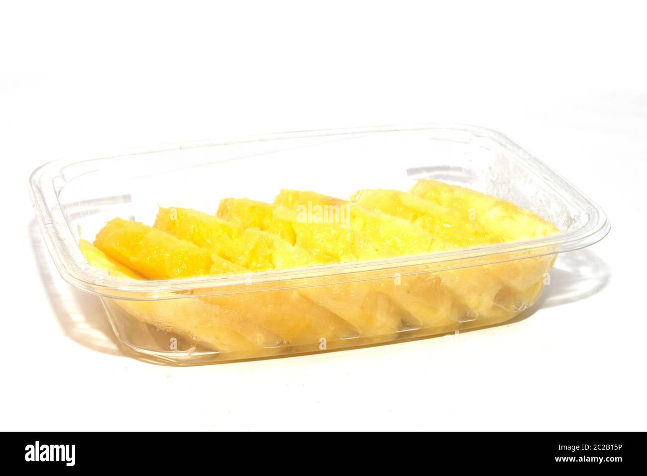 pineapple in a pan cut into slices Stock Photo