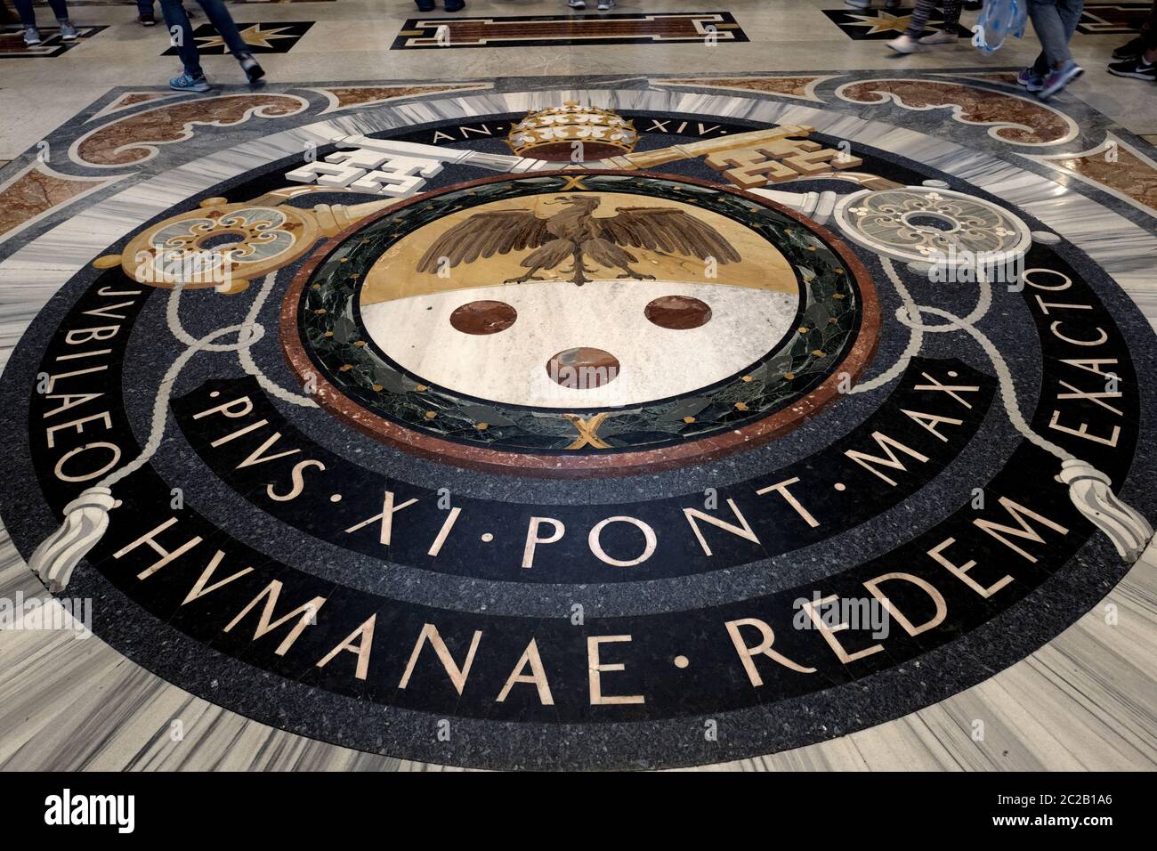 The Vatican's state symbol on the floor of the Saint Peter's cathedral, in Rome. Stock Photo