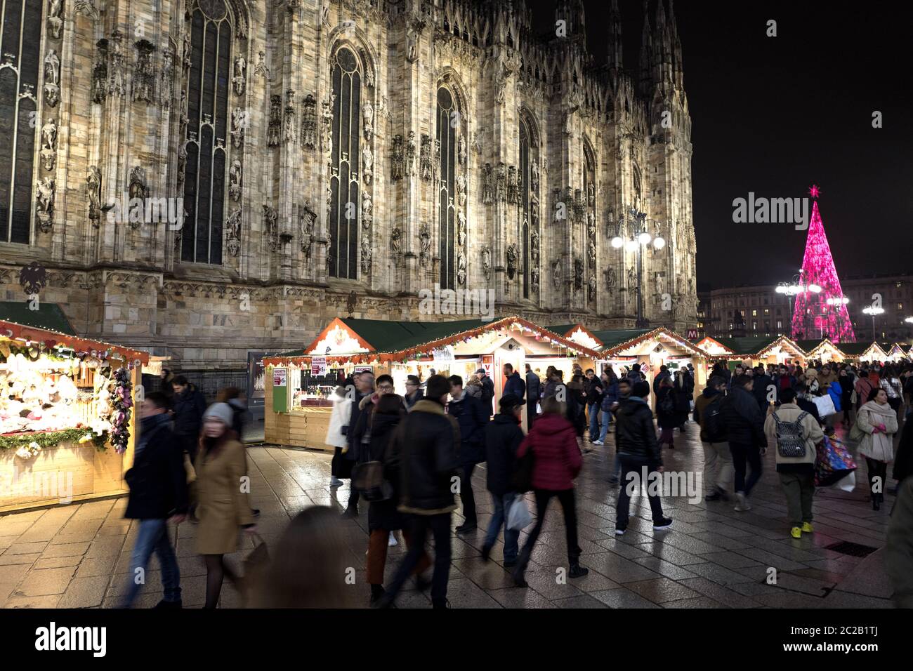 Night Christmas market by the gotici Duomo cathedral of Milan, Italy. Stock Photo