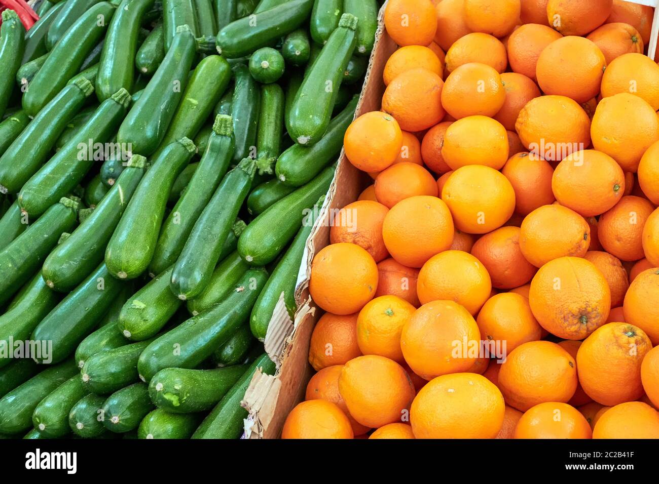 Oranges and gherkins for sale at a market Stock Photo