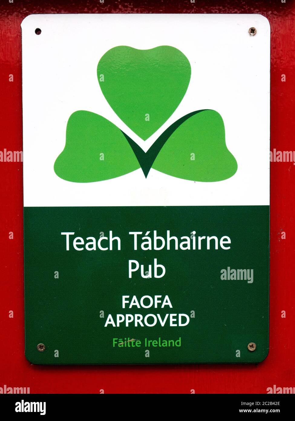 A Gaelic Sign , sign, “Teach Tabhairne” Irish Language Plaque Outside A Pub In Dublin Ireland Stock Photo