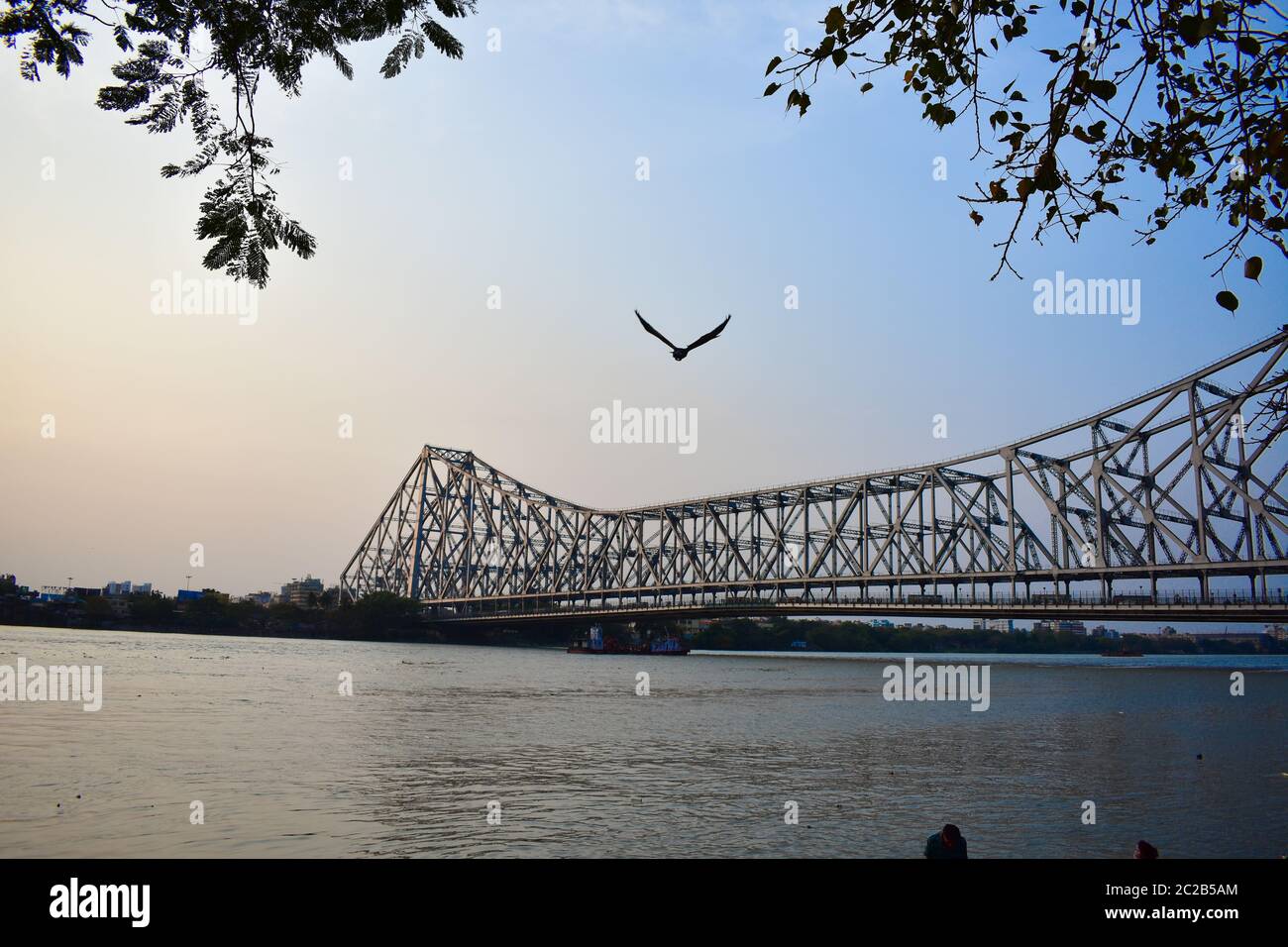 Howrah Bridge is an iconic landmark of Kolkata, India. It is a massive steel bridge constructed over the Hooghly River, was commissioned in 1943. Stock Photo