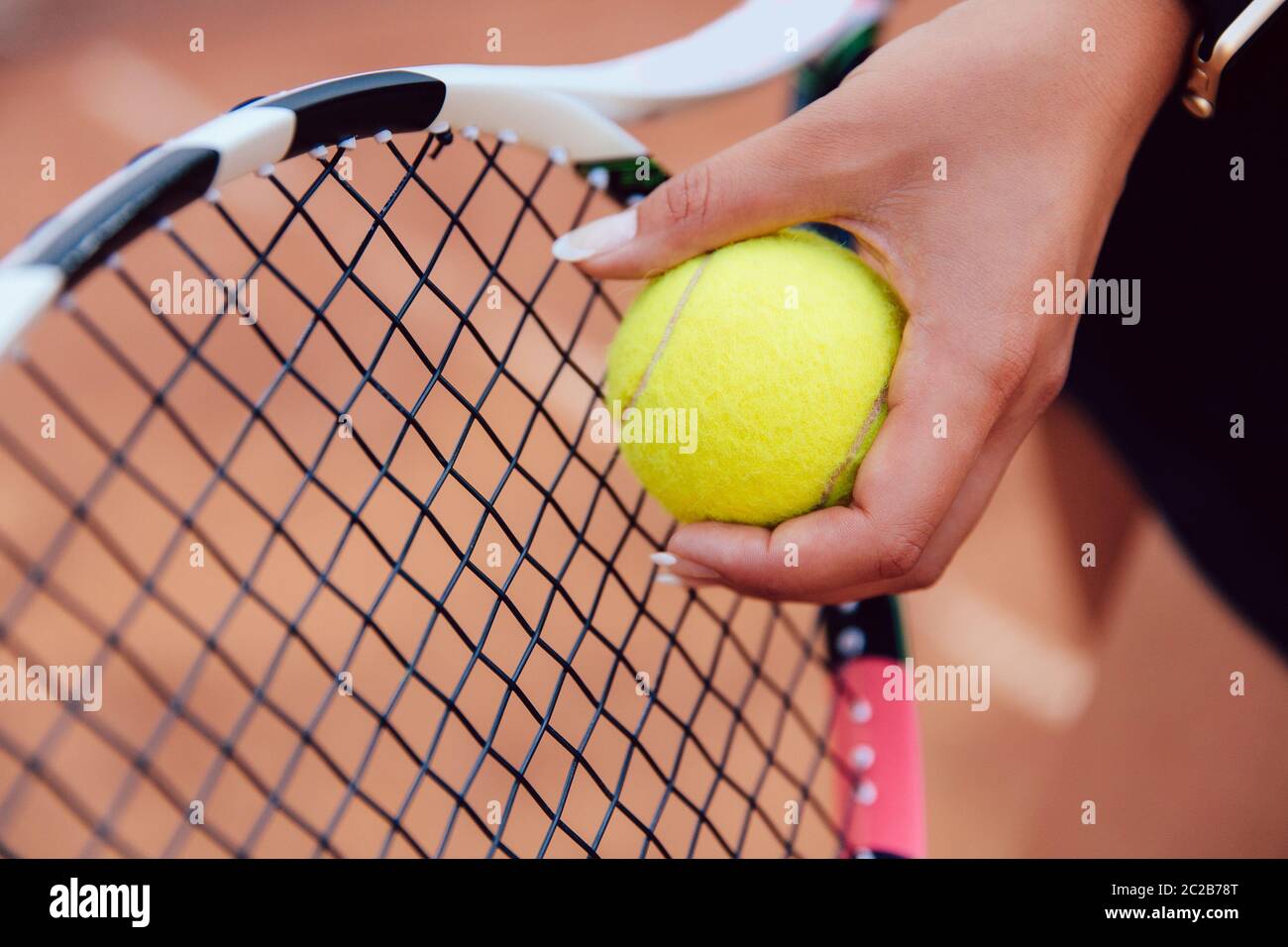 Female Player S Hand With Tennis Ball Preparing To Serve During A Match Close Up View Stock Photo Alamy