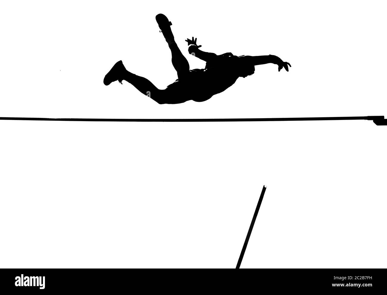 pole vault springer crossing the bar in black and white Stock Photo