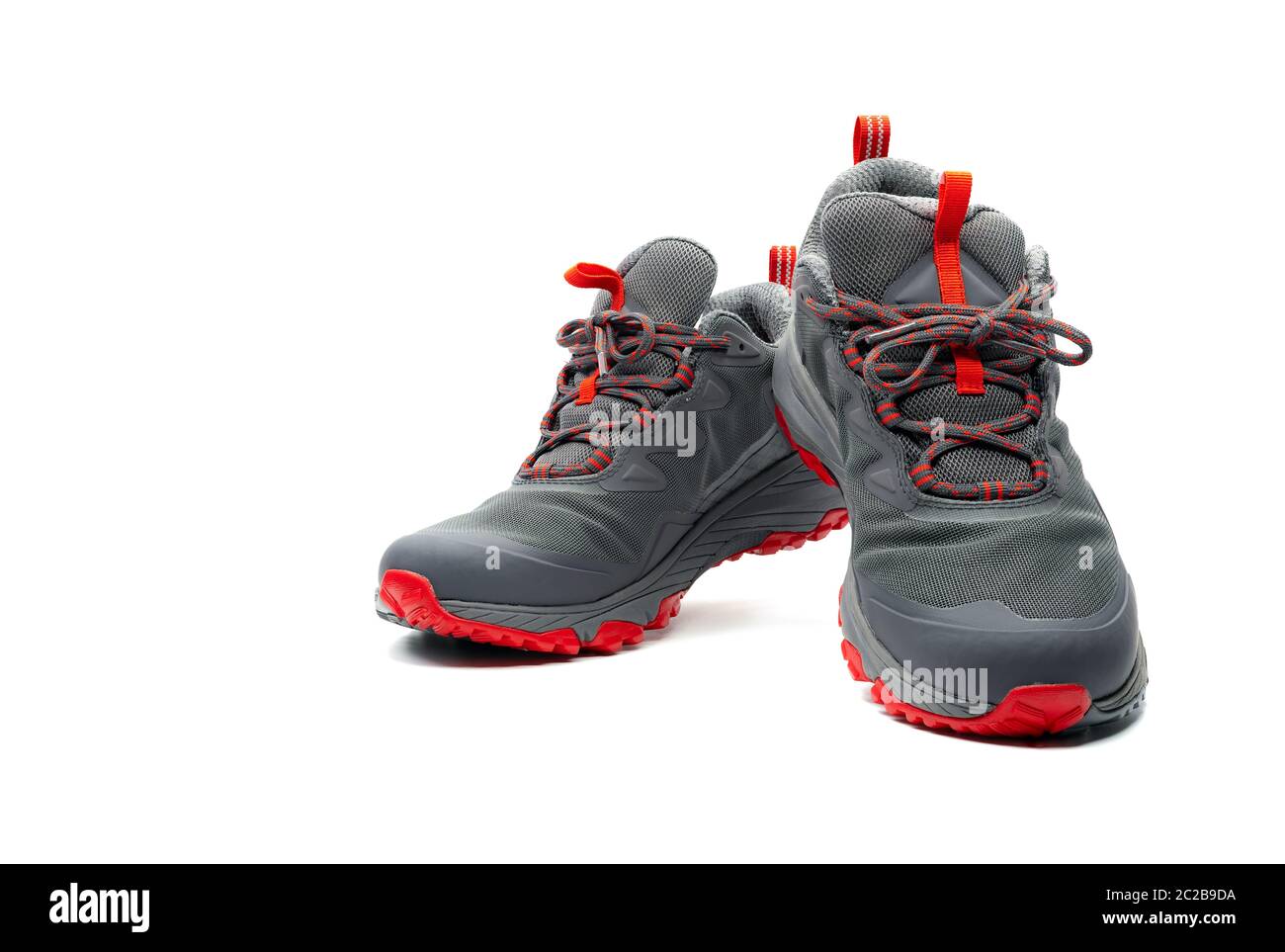 Men trekking shoes isolated on white background. Grayred hiking shoes