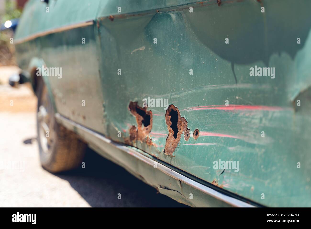 broken part of car body with rusty on concrete floor Stock Photo - Alamy