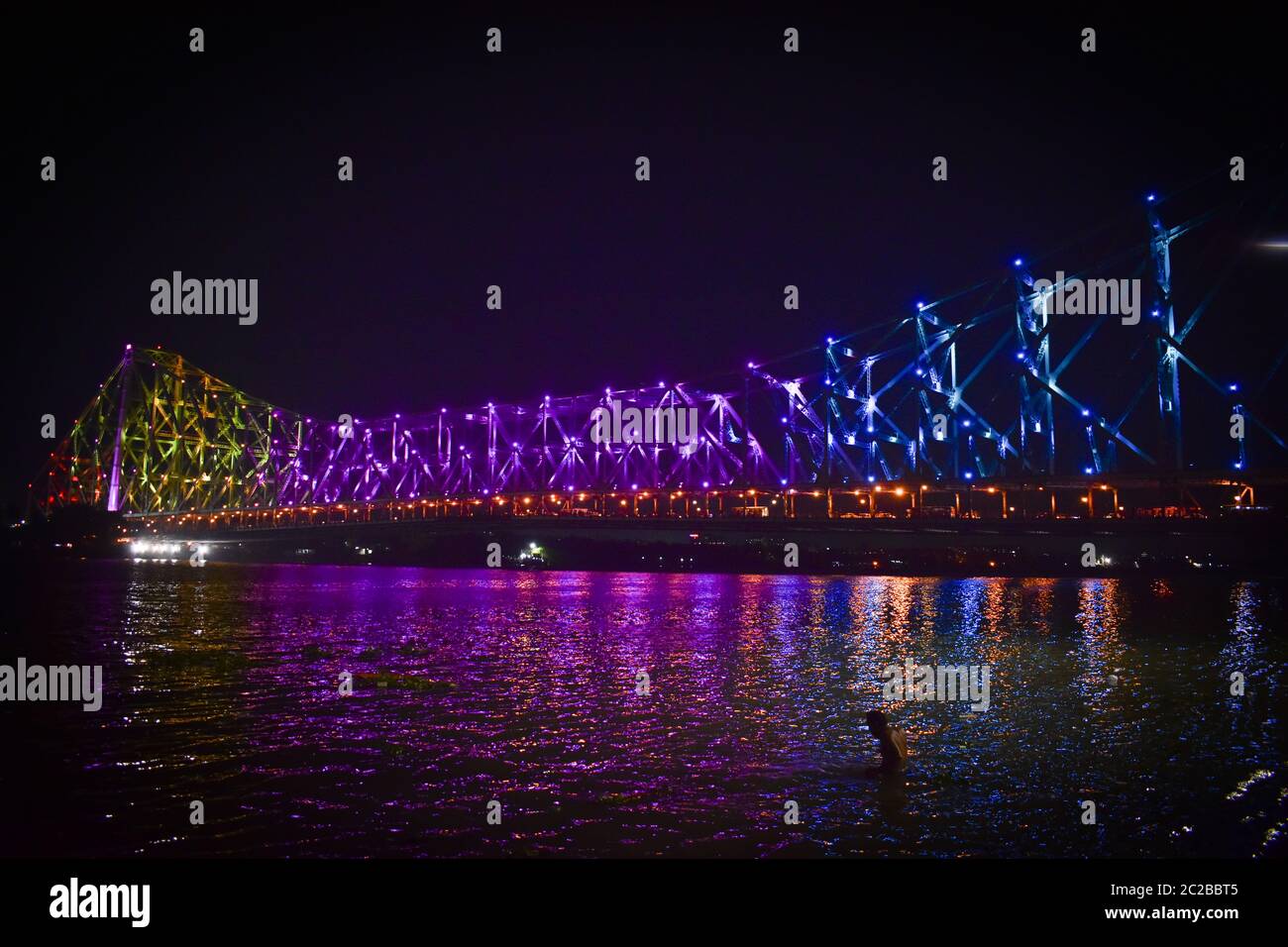 Howrah Bridge is an iconic landmark of Kolkata, India. It is a massive steel bridge constructed over the Hooghly River, was commissioned in 1943. Stock Photo