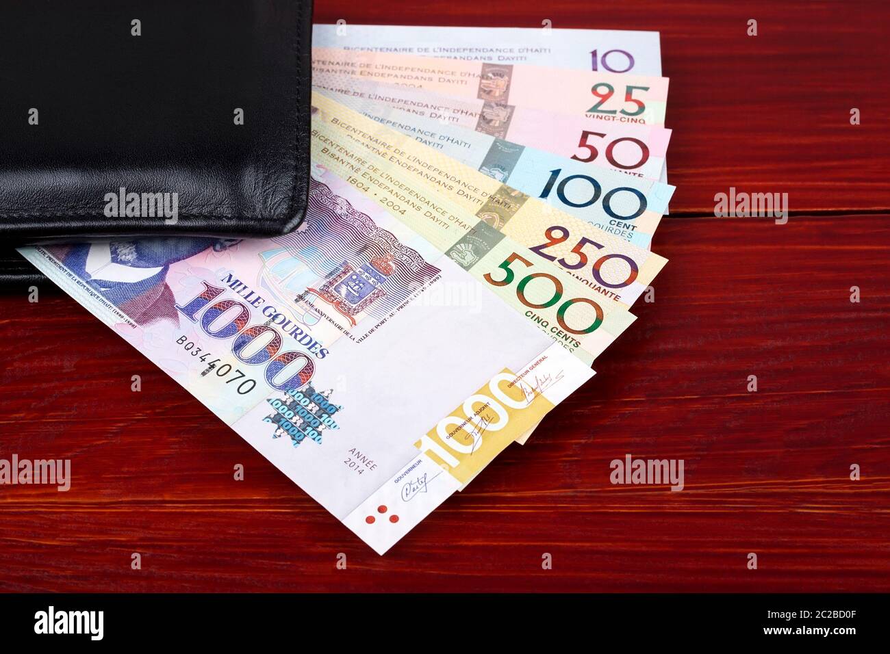 Haitian money in the black wallet Stock Photo Alamy