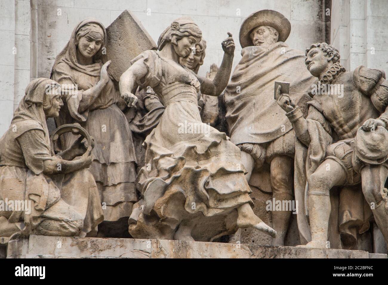 Relief stone carving of a scene from the novella La Gitanilla (the Little Gypsy Girl): Cervantes Monument, Plaza de Espana, Madrid Stock Photo