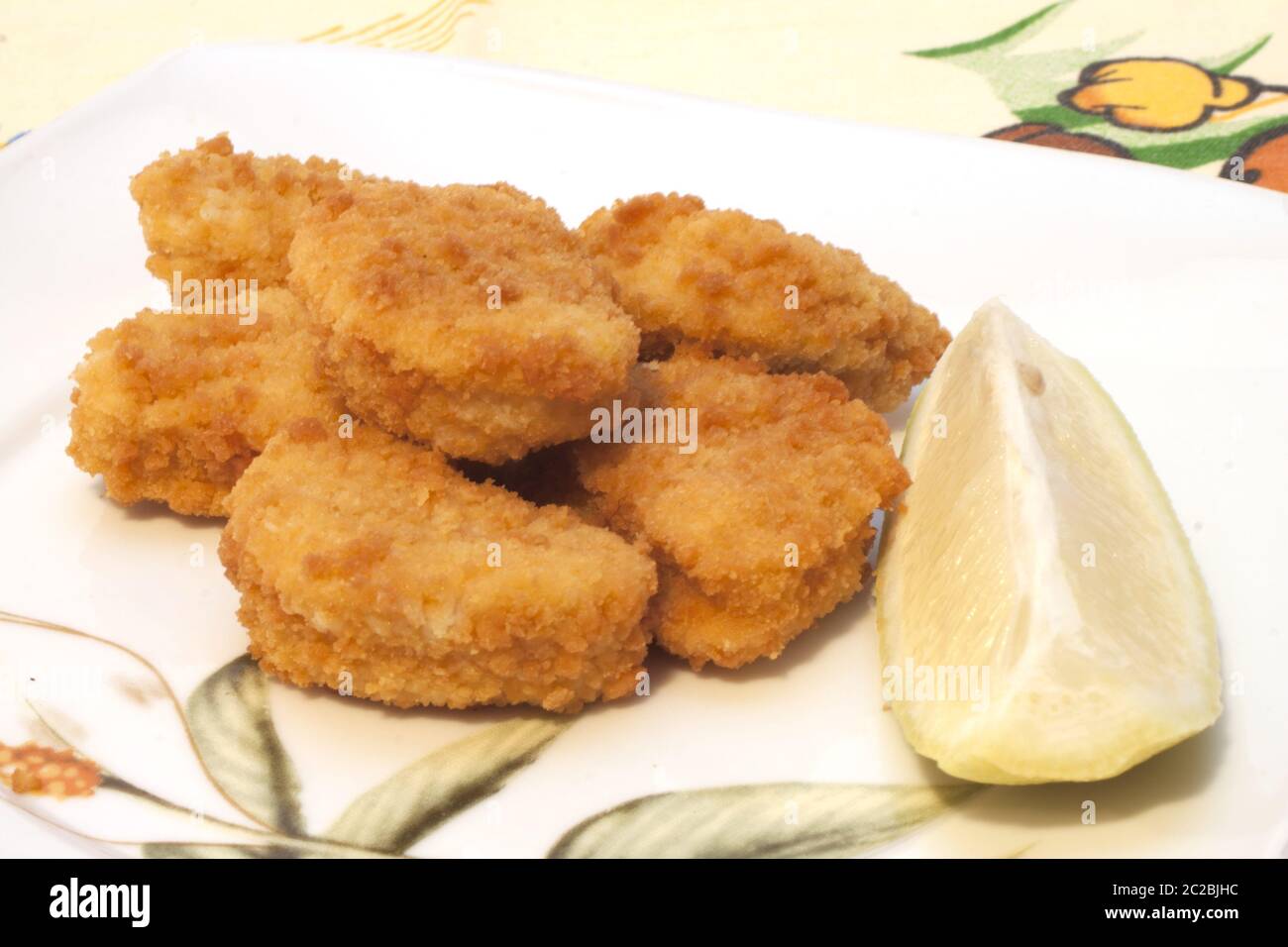 breaded chicken nuggets with packaging Stock Photo