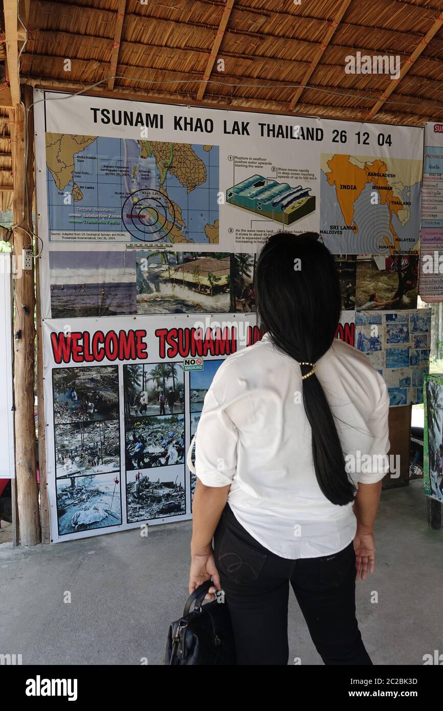 10 March 2020, Thailand, Kao Lak: A Thai woman looks at the displays of the exhibition in the tsunami memorial. In Thailand, the touristically developed coast on the Andaman Sea was particularly affected by the tidal waves of the tsunami on 26 December 2004, especially the holiday centres Khao Lak and Ko Phuket as well as the island Ko Phi Phi. Photo: Alexandra Schuler/dpa Stock Photo