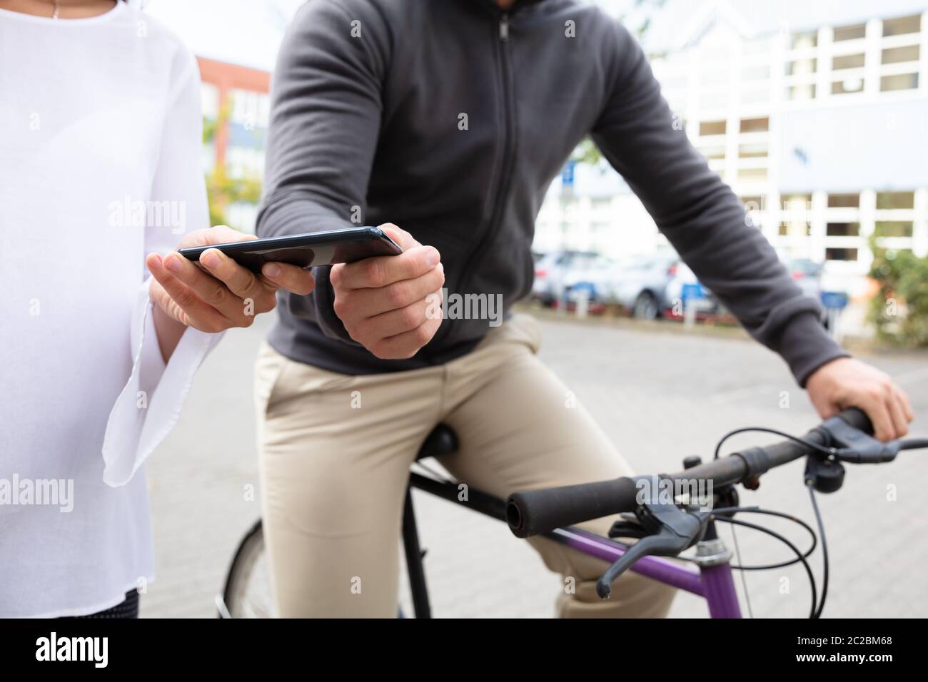 Male Thief Riding On Bicycle Snatching The Mobile Phone From Woman's ...