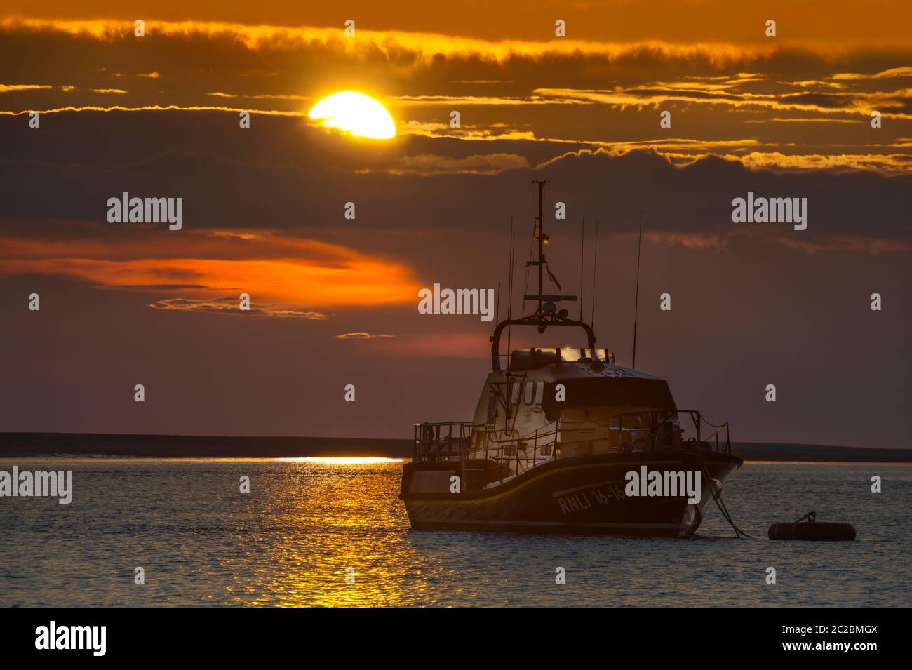 'Mollie Hunt', the RNLI Tamar-Class all weather lifeboat at her mooring in Appledore North Devon on a summer's evening in June. Stock Photo