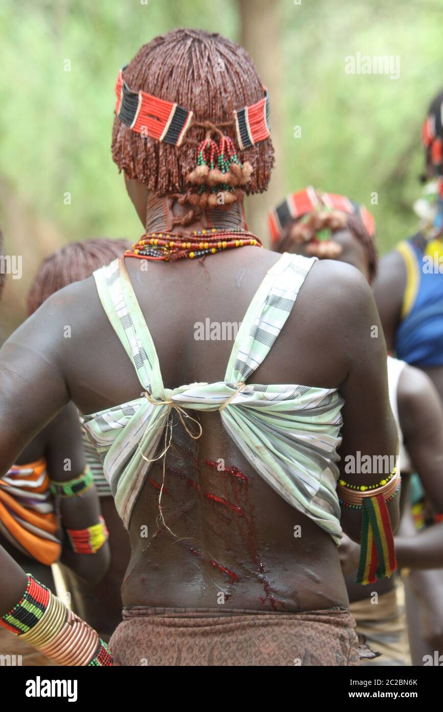 Africa, Ethiopia, Omo River Valley Hamer Tribe Women are willing to be whipped by relatives to show their loyalty and love. They do not flinch or show Stock Photo