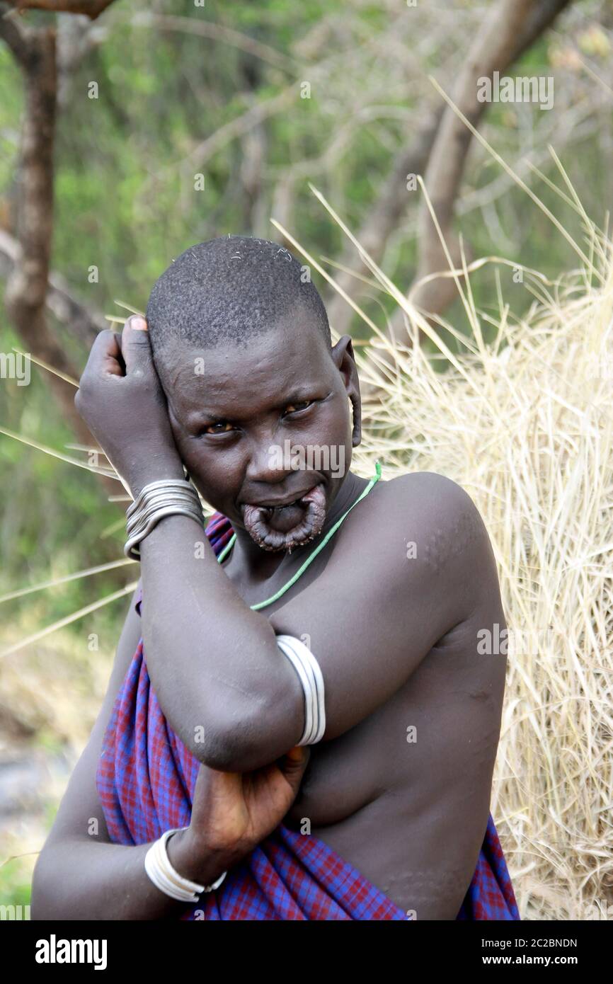Africa, Ethiopia, Debub Omo Zone, Mursi tribesmen. A nomadic cattle herder ethnic group located in Southern Ethiopia, close to the Sudanese border. Wo Stock Photo