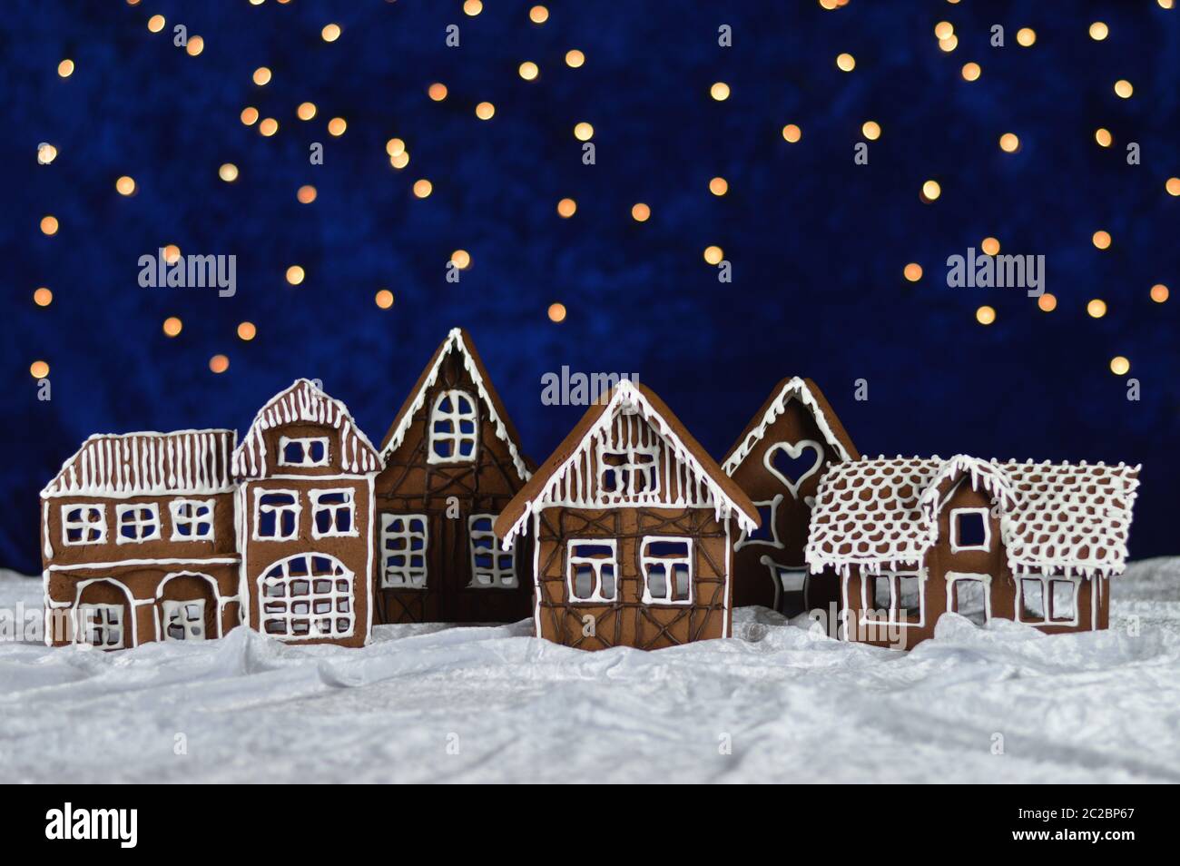 home made gingerbread village with bokeh sky Stock Photo