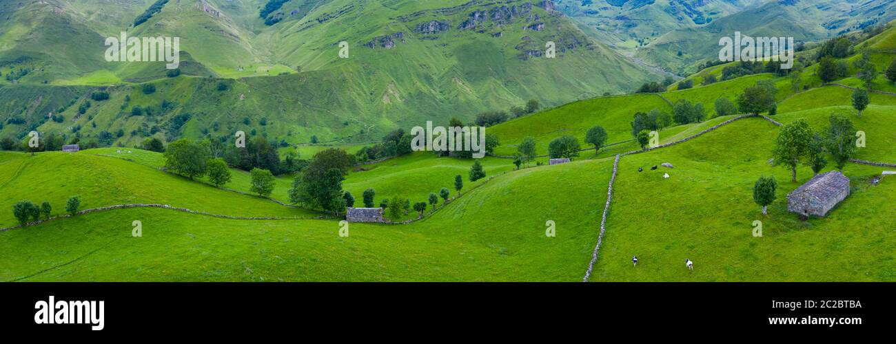 Aerial view with a drone of the spring landscape of pasiegas cabins and meadows in Miera Valley in Autonomous Community of Cantabria. Spain, Europe Stock Photo
