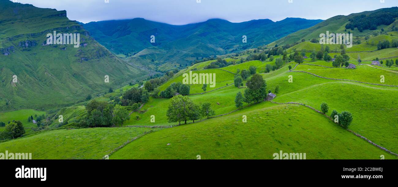 Aerial view with a drone of the spring landscape of pasiegas cabins and meadows in Miera Valley in Autonomous Community of Cantabria. Spain, Europe Stock Photo