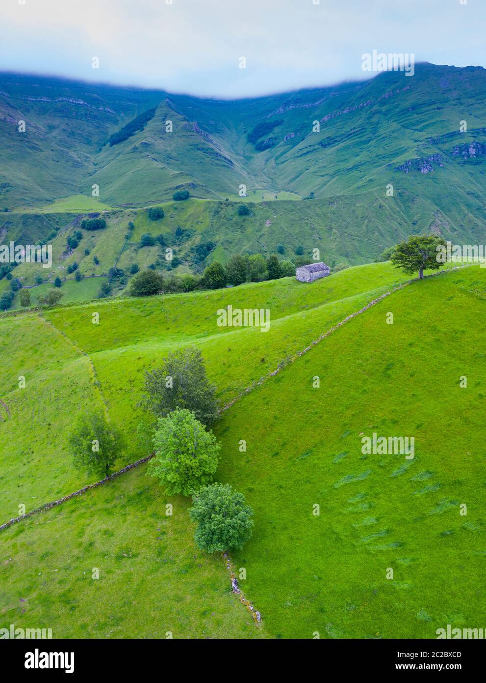 Aerial view with a drone of the spring landscape of pasiegas cabins and meadows in Miera Valley in Autonomous Community of Cantabria. Spain, Europe Stock Photo