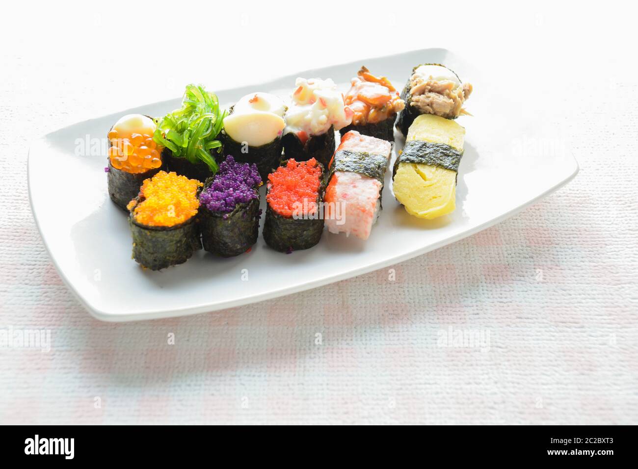 Sushi on white plate, tuna, salmon, sea bass, sweet egg, shrimp sushi
